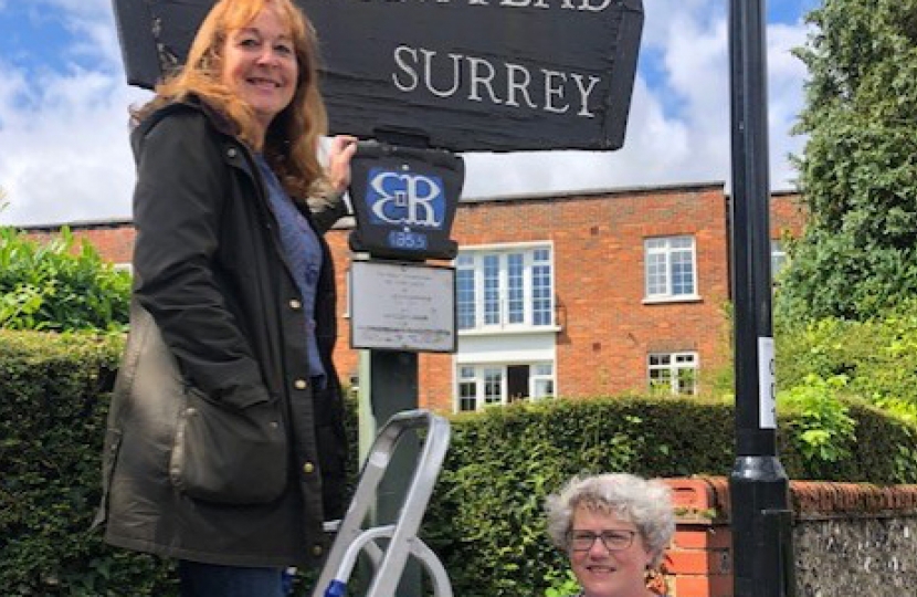 Lynne and SRA Chairman, Heather, inspecting the Sanderstead sign